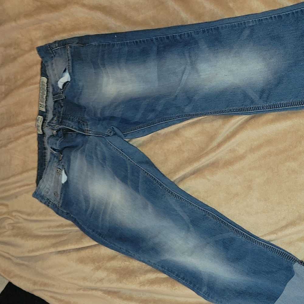 Faded blue Capri jeans